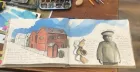 Open sketchbook with illustrations of a row of neat wood houses and a stern police officer.