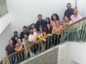 12 or so participants of the Cultural Mobility Developers Workshop in Tunis, gathered on a staircase.